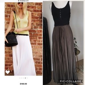 Long pleated olive green skirt with frayed hem